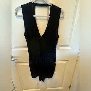 Brand new Becca 1 piece black romper size small